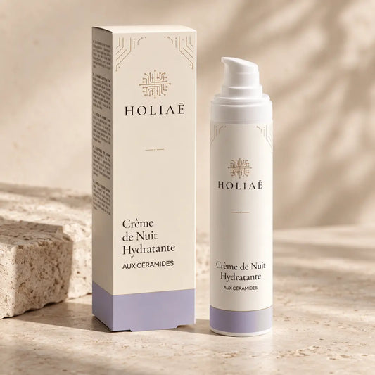 Crème de Nuit Visage aux Céramides HOLIAĒ avec pot et étui sur fond ivoire