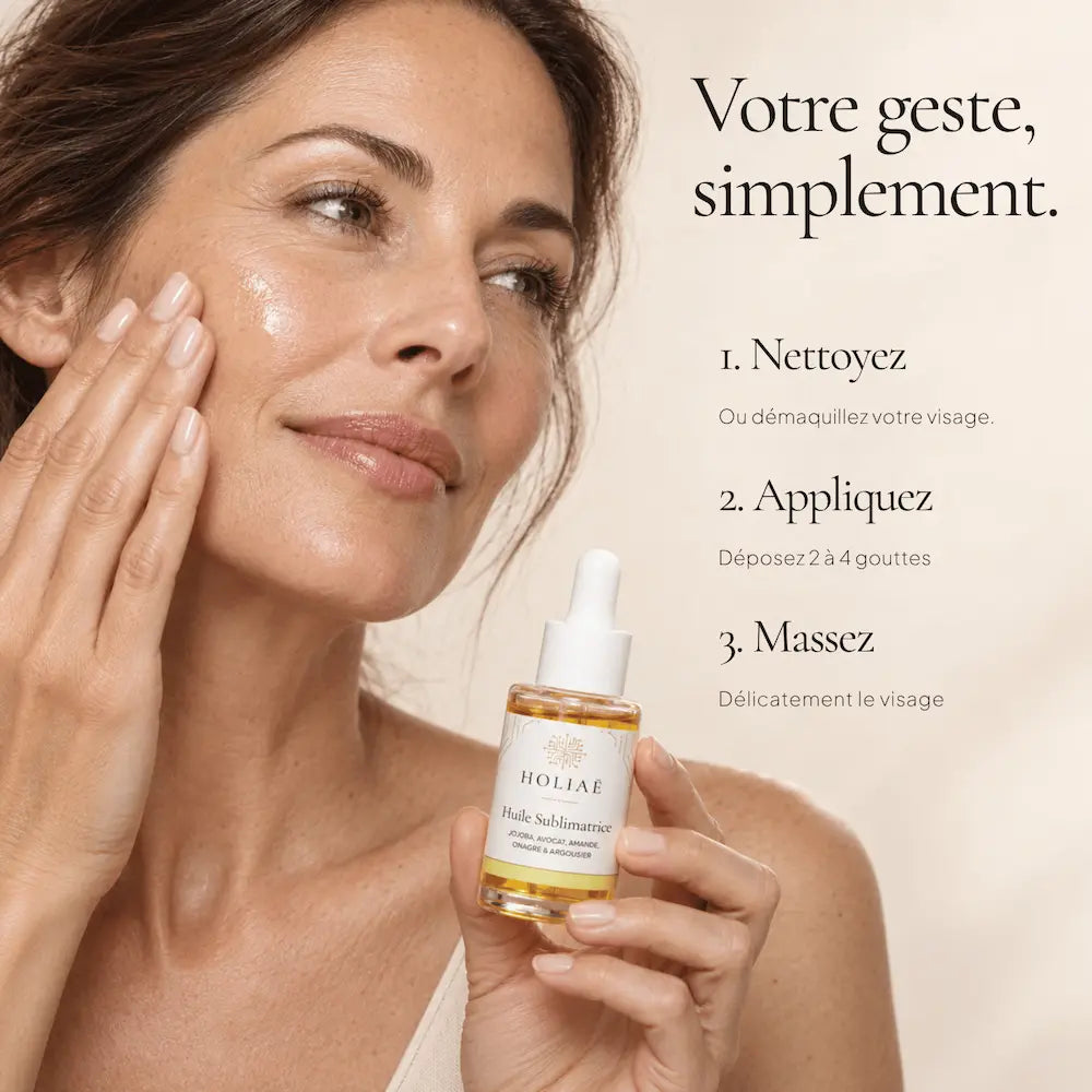 Application de quelques gouttes d’Huile Visage Hydratante & Sublimatrice HOLIAĒ sur le visage