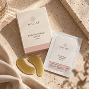 Patchs Yeux Hydrogel Hydratants & Lissants HOLIAĒ en mise en scène éditoriale sur travertin