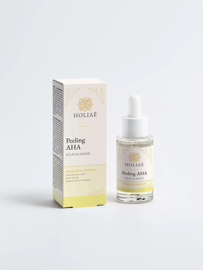 Peeling visage AHA Holiaē Novaē posé devant son étui, sur fond clair, soin exfoliant lactique 10%.
